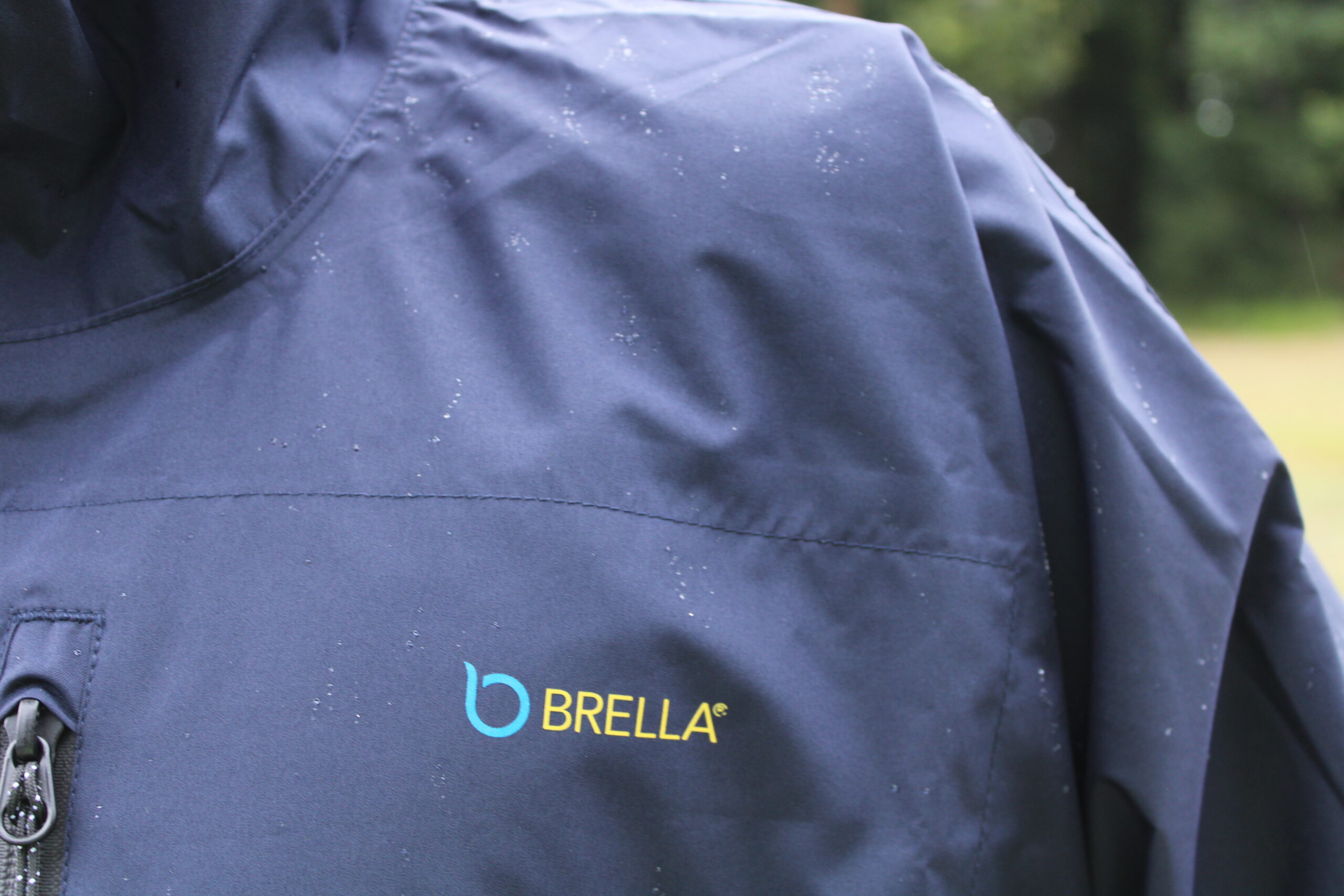 Close-up of a man's shoulder wearing a Brella raincoat. New Rain Gear From Brella: Next Level Weather Protection