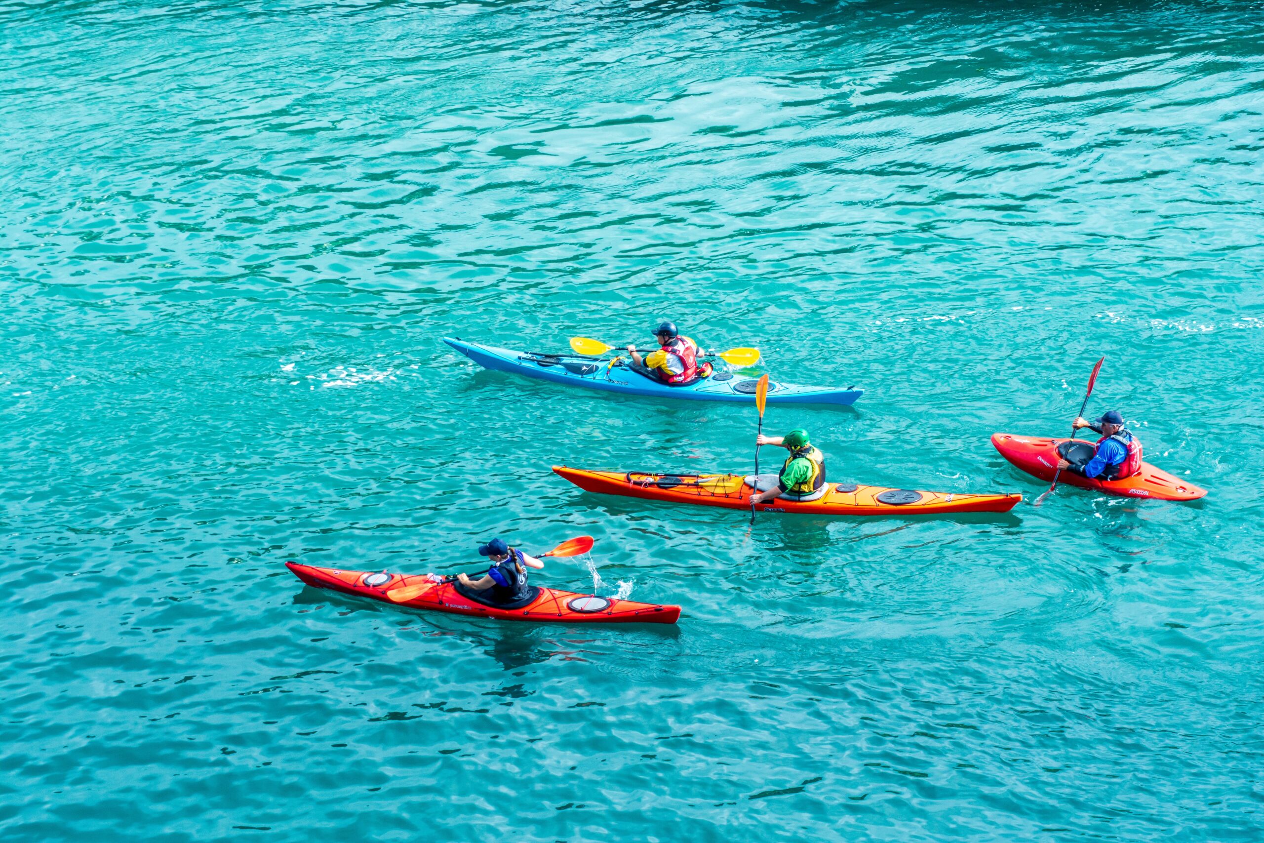 Kayaks on blue water Tips for Safe Water Sports