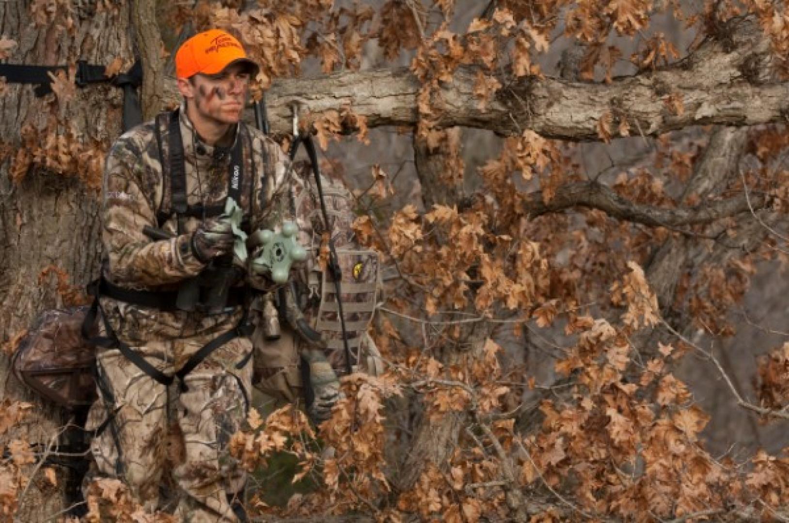 Hunter waiting in tree stand deer hunting Treestand Safety Tips for Successful Hunt