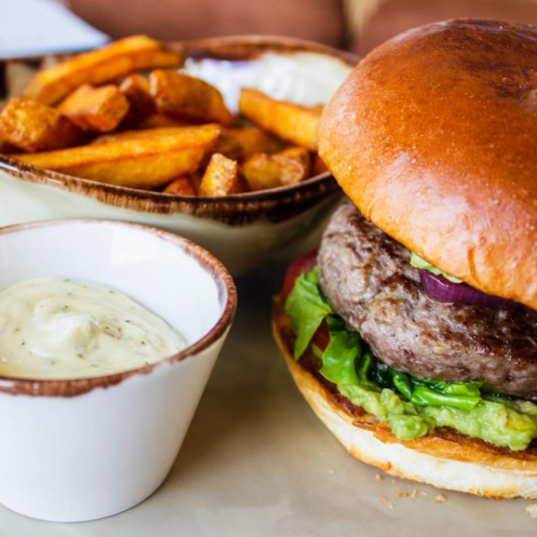 Close up shot of burger with fries How to Make the Perfect Venison Burger