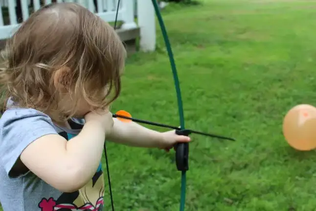 Young girl tries archery